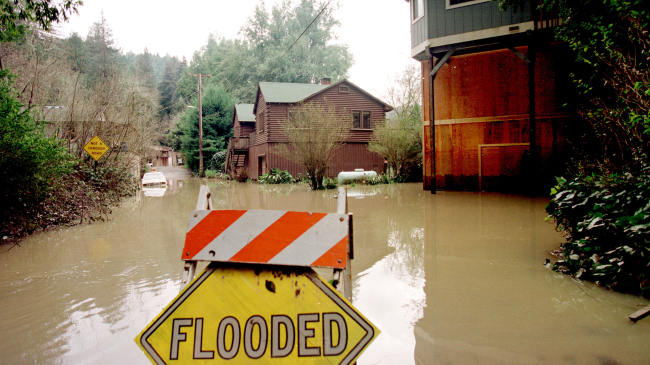 Flooded homes along the Russian River in California. NOAA scientists and colleagues are installing the first of four permanent "atmospheric river observatories" in California this month, to better monitor and predict the impacts of powerful winter storms associated with atmospheric rivers
