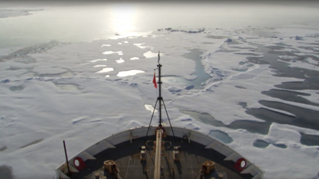 Icebreaker traveling through icy Arctic waters.
