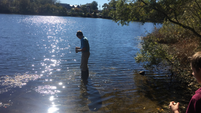 Students from the Lawrence School in Falmouth, MA taking water quality samples as part of their project to raise awareness about the coastal pond near their school.