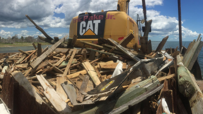 Removing dock debris left in the wake of Hurricane Florence, September 2018.