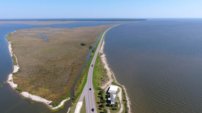 
One of the grants will complete the design and implementation for a breakwater and coastal marsh in Mobile Bay, on the east side of the Dauphin Island Causeway (above), in Alabama. It will also create and protect critical coastal marsh habitat and reduce the vulnerability of the only emergency and hurricane evacuation route between the mainland of south Mobile County and Dauphin Island.​ 
