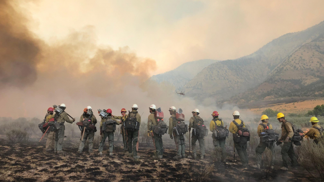 Firefighters on the march: The Pine Gulch Fire, smoke of which shown here, was started by a lightning strike on July 31, 2020, approximately 18 miles north of Grand Junction, Colorado. According to InciWeb, as of August 27, 2020, the Pine Gulch Fire became the largest wildfire in Colorado State history, surpassing the Hayman Fire that burned near Colorado Springs in the summer of 2002. 