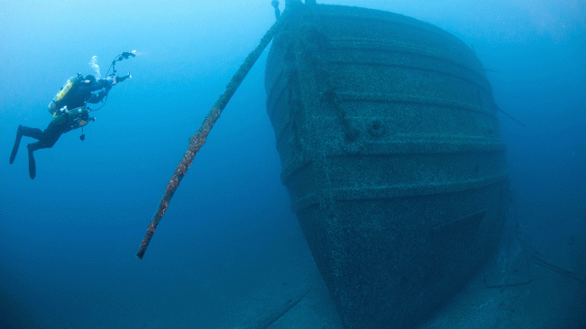 A scuba diver near the shipwreck of the package freighter Florida in Thunder Bay National Marine Sanctuary. Undated image.
