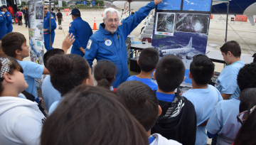 NOAA's Dr. James McFadden and U.S. Air Force personnel introduce school children to the hurricane hunter mission