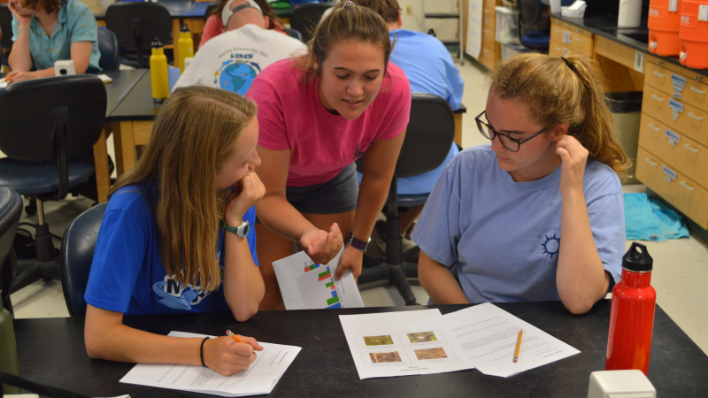 Stephanie Letourneau, a 2018 NOAA Hollings scholar, answers student questions while teaching her lesson plan on thin-layer placement at the Virginia Institute of Marine Science's summer camp.