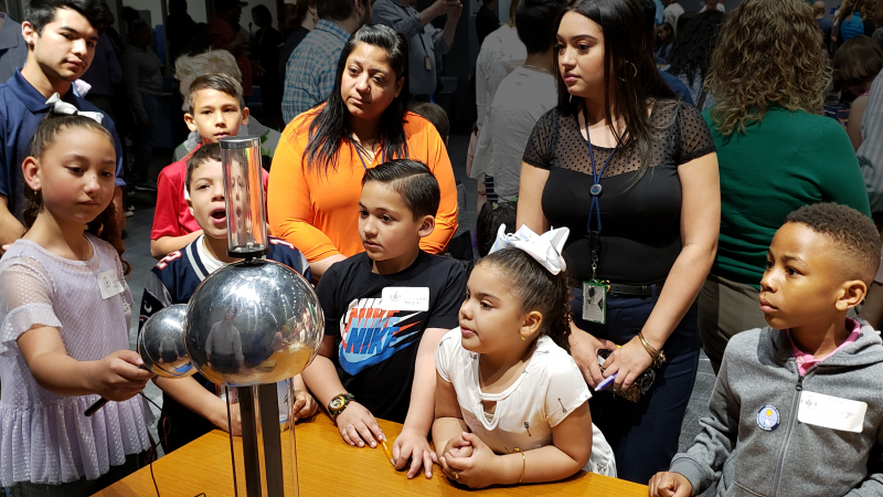 At NOAA Kids Day, the NOAA family was invited to bring their kids to work at the Silver Spring, Maryland, campus on April 25, 2019. The National Weather Service brought a Van de Graaff machine, an electrostatic generator which uses a moving belt to accumulate electric charge on a hollow metal globe on the top of an insulated column. This creates very high electric potentials, and is used to teach about electricity, or in this case, lightning strikes.