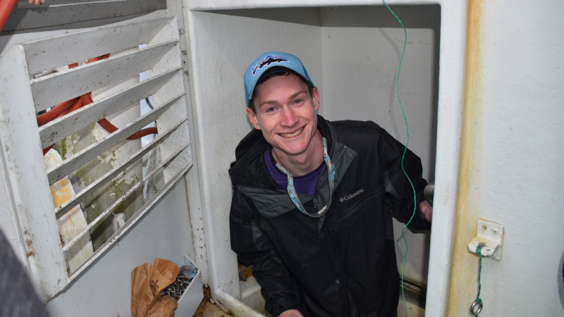 Kenneth Erickson climbs out of the engine room of a commercial fishing vessel in Louisiana during the Louisiana Sea Grant Graduate Research Scholar’s trip in December of 2018.