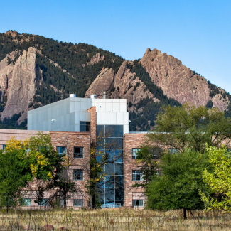 View of David Skaggs Research Center with the Flatirons (mountains) in the background.
