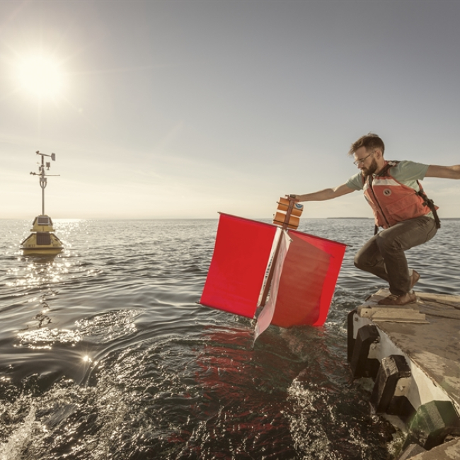 NOAA GLERL scientist Eric Anderson deploys a drifter buoy from the back of a research vessel in the Straits of Mackinac. The buoy will move with the currents, reporting its location every hour via satellite. Eric and his NOAA Research colleagues Andrew Hoell, Andrew Rollins, Brian C. McDonald and Jeffrey Snyder are recipients of the 2019 Presidential Early Career Award for Scientists and Engineers (PECASE).