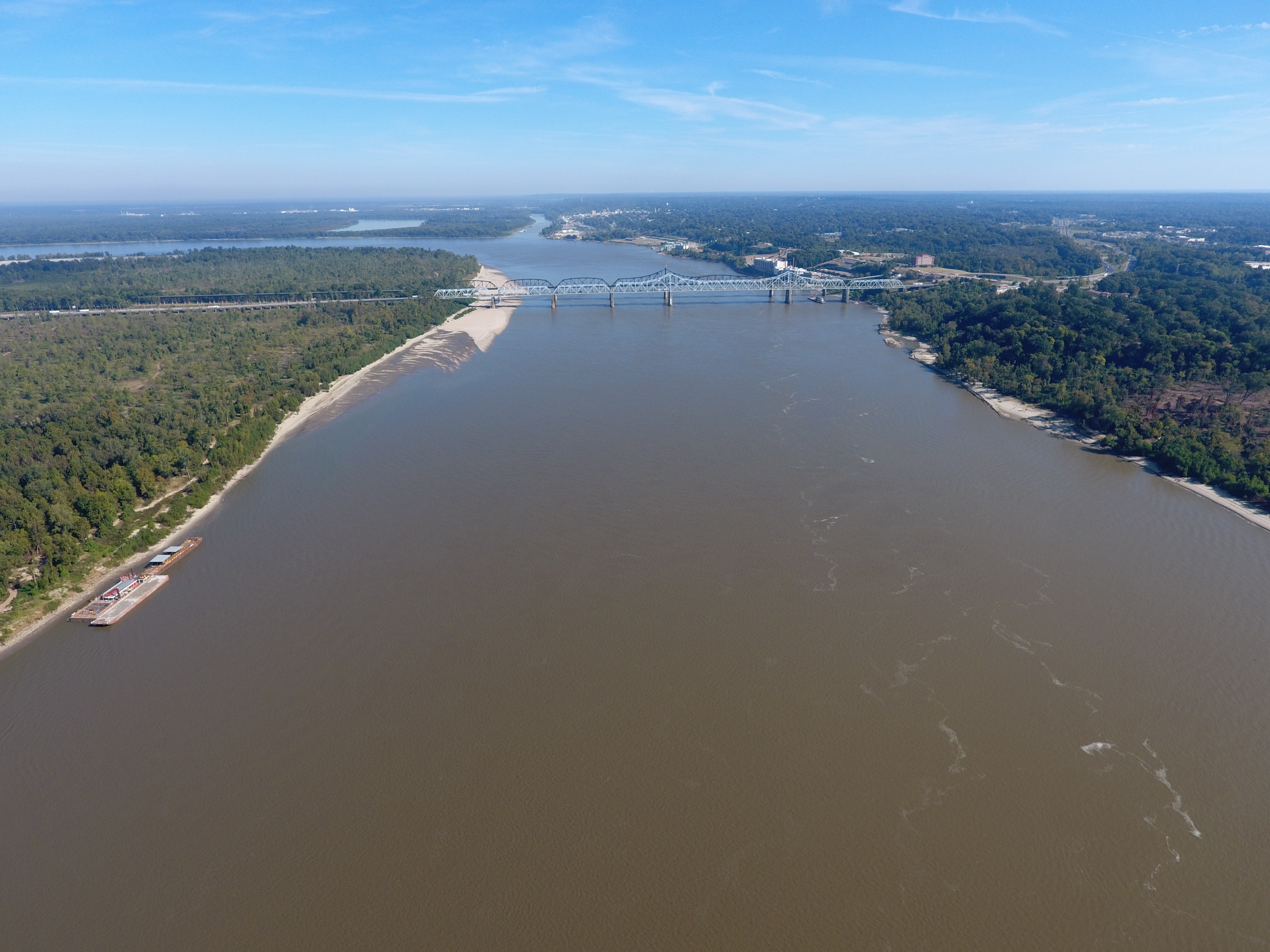 An aerial drone photo of the Mississippi River near Vicksburg, MS, looking Northeast at the I-20 bridge, the confluence of the Yazoo River is in the foreground.