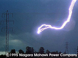Lightning striking a power line. Notice it DID NOT strike the towers though they are taller than the position where lightning struck.
