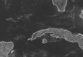 Opposing sea breezes meeting over Cuba forming a line of cumulus clouds.