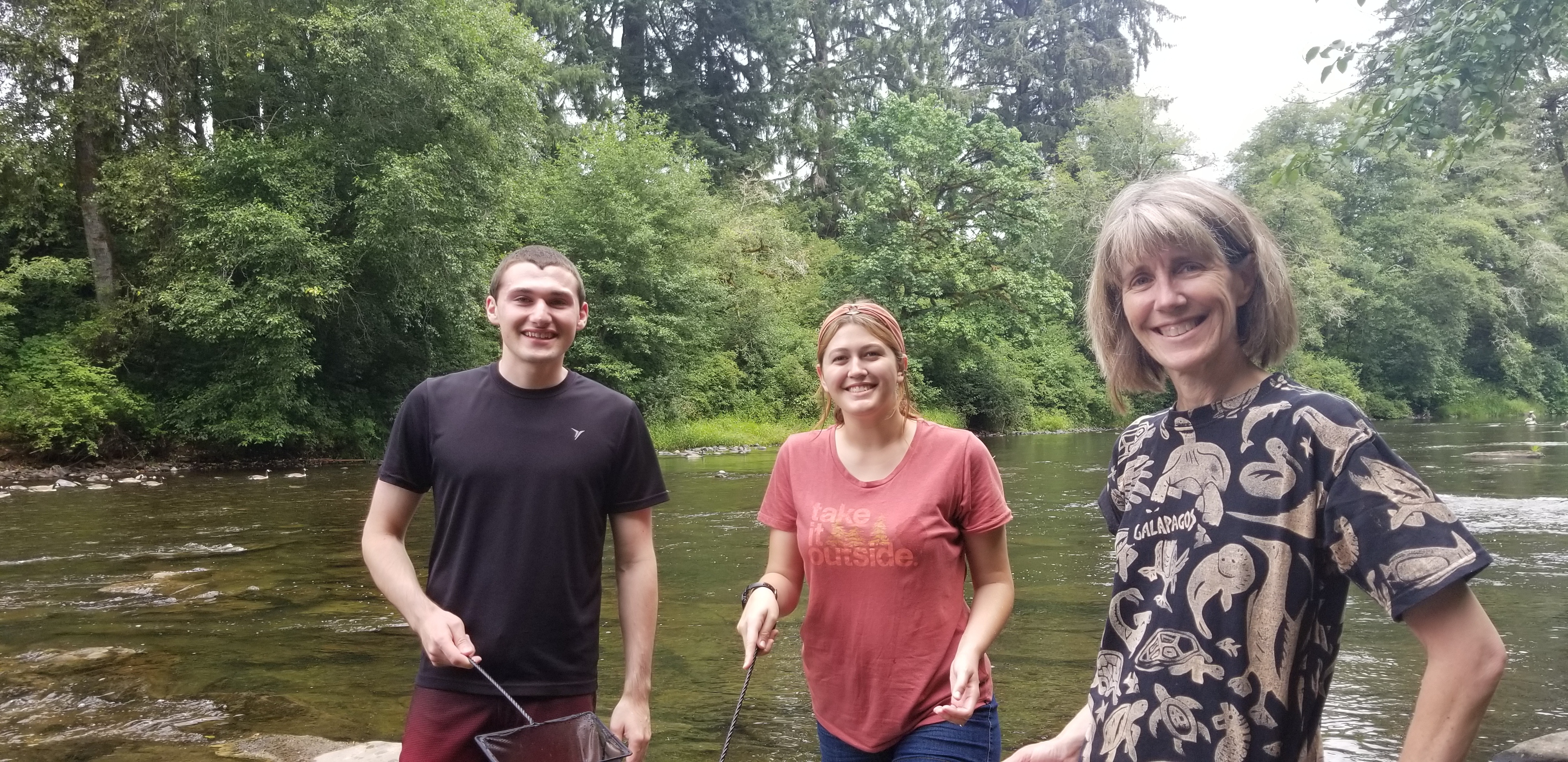 2018 NOAA Hollings scholar Mark DeSimone (left), 2018 NOAA EPP/MSI undergraduate scholar Delaena Stephens (middle), and mentor Kym Jacobson (right) searching for snails in the river to collect their parasites for an educational seminar.