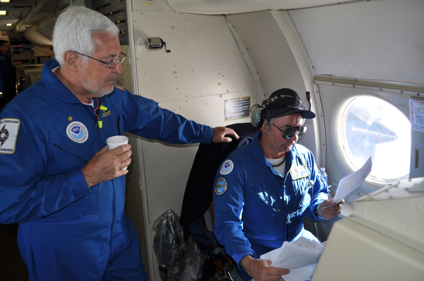 Dr. James McFadden (left) aboard a NOAA Lockheed WP-3D Orion May 6, 2011 during the 2011 Hurricane Awareness Tour.