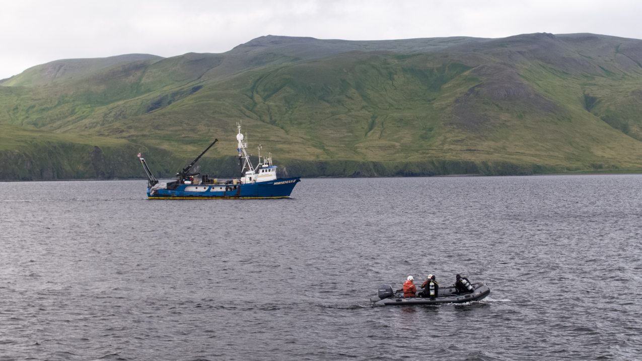 Photo showing two boats that were part of an expedition in Kiska, Alaska, to survey historic battlefields from World War II and document and honor the final resting place of U.S. and Japanese service members who lost their lives in the waters surrounding Kiska Island.