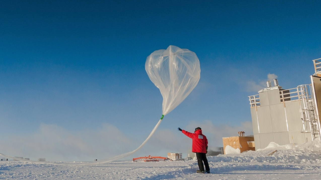 Researchers release a weather balloon carrying an ozone sonde, a lightweight sensor, during the 2016 ozone hole research season at the South Pole.