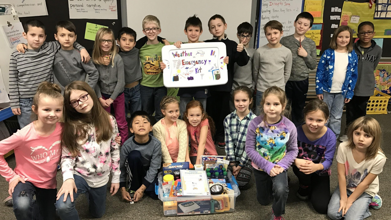 Instead of creating a traditional gift basket for their annual holiday auction, these second-graders decided to prepare a weather-ready kit.