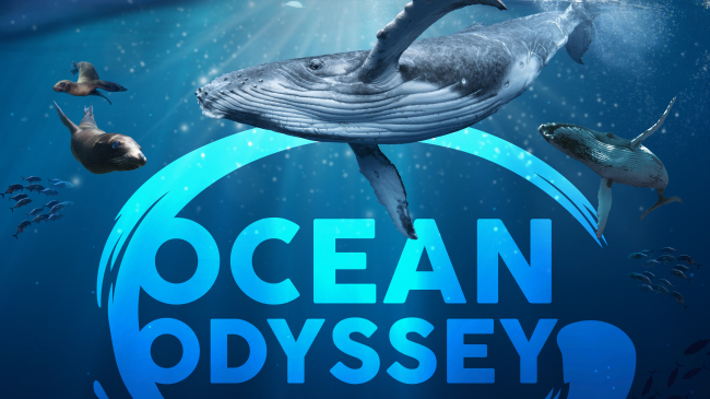 An underwater ocean scene with whales, fish and seals. Text: Exploring our ocean's big blue heart. Ocean Odyssey featuring Dr. Sylvia Earle, a giant screen experience
