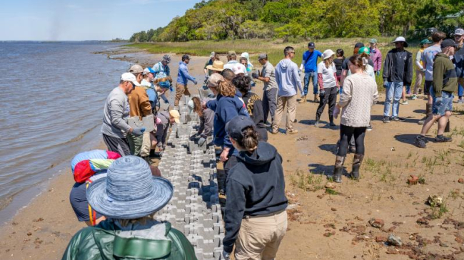 Volunteers building an oyster castle living shoreline reef near Marine Corps Air Station Beaufort.