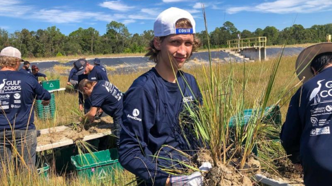 Young adults engage in habitat restoration and coastal resilience projects in Florida.