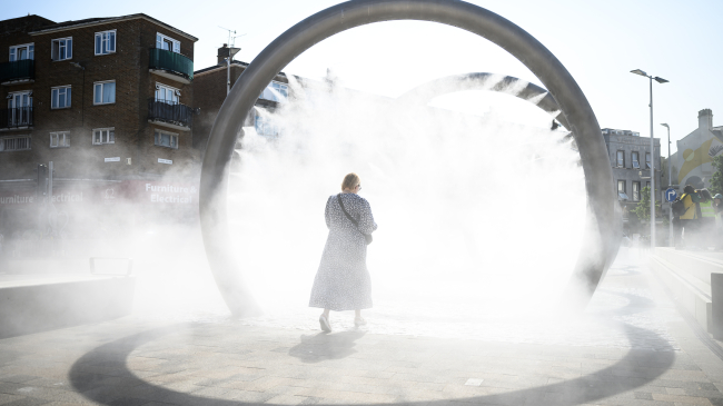 AUGUST 17, 2024: A person walks through an art installation as it sprays a cloud of cool water vapor in Dover, United Kingdom. August 2024 was Europe’s — and the world’s — warmest August on record.