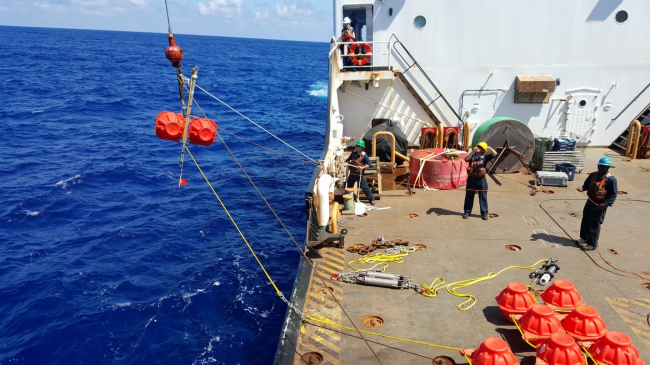 Top pair of floats going in as Full Ocean Depth Hydrophone is deployed in Challenger Deep on July 28, 2015. 


