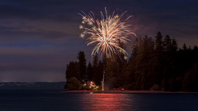 Independence Day fireworks at Agate Pass, between Bainbridge Island and the Olympic Peninsula, in Washington state. 