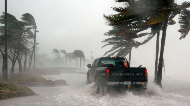 Rain and flooding lashed Key West in Florida during Hurricane Dennis on July 8, 2005. Since the 1980s, average annual damages from weather and climate-related billion-dollar disasters have more than quadrupled in the United States. 