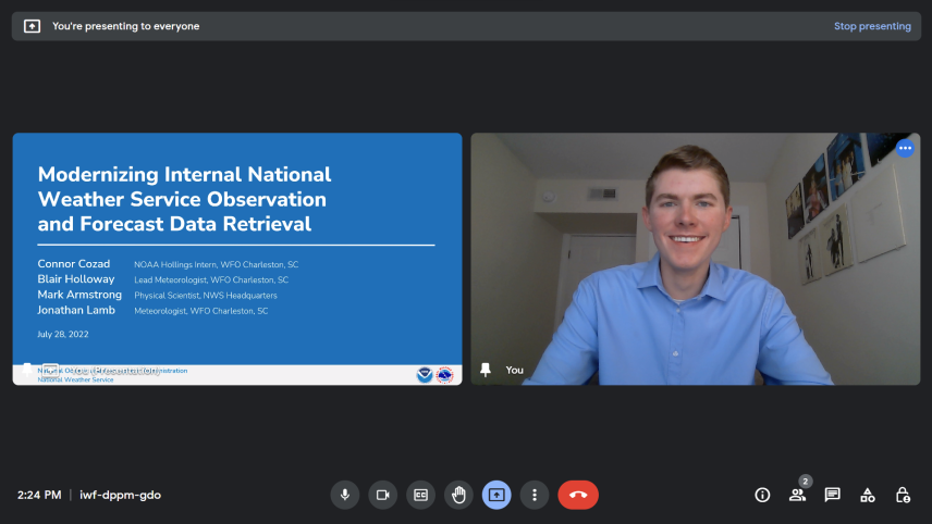 A screenshot of Connor preparing to give a virtual presentation from a home office on July 28, 2022. Next to a tile with his video, his title slide is being shared. It reads: Modernizing Internal National Weather Service Observation and Forecast Data Retrieval. Connor Cozad, NOAA Hollings intern, WFO Charleson, SC. Blair Holloway, Lead Meteorologist, WFO Charleston, SC. Mark Armstrong, Physical Scientist, NWS Headquarters. Jonathan Lamb, Meteorologist, WFO Charleston, SC. 
