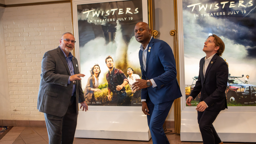NOAA National Severe Storms Laboratory staff mimic the Twisters movie poster during the Los Angeles premiere on July 11, 2024. (L to R) Kurt Hondl, deputy director; DaNa Carlis, director; Wes Moody, communications specialist.