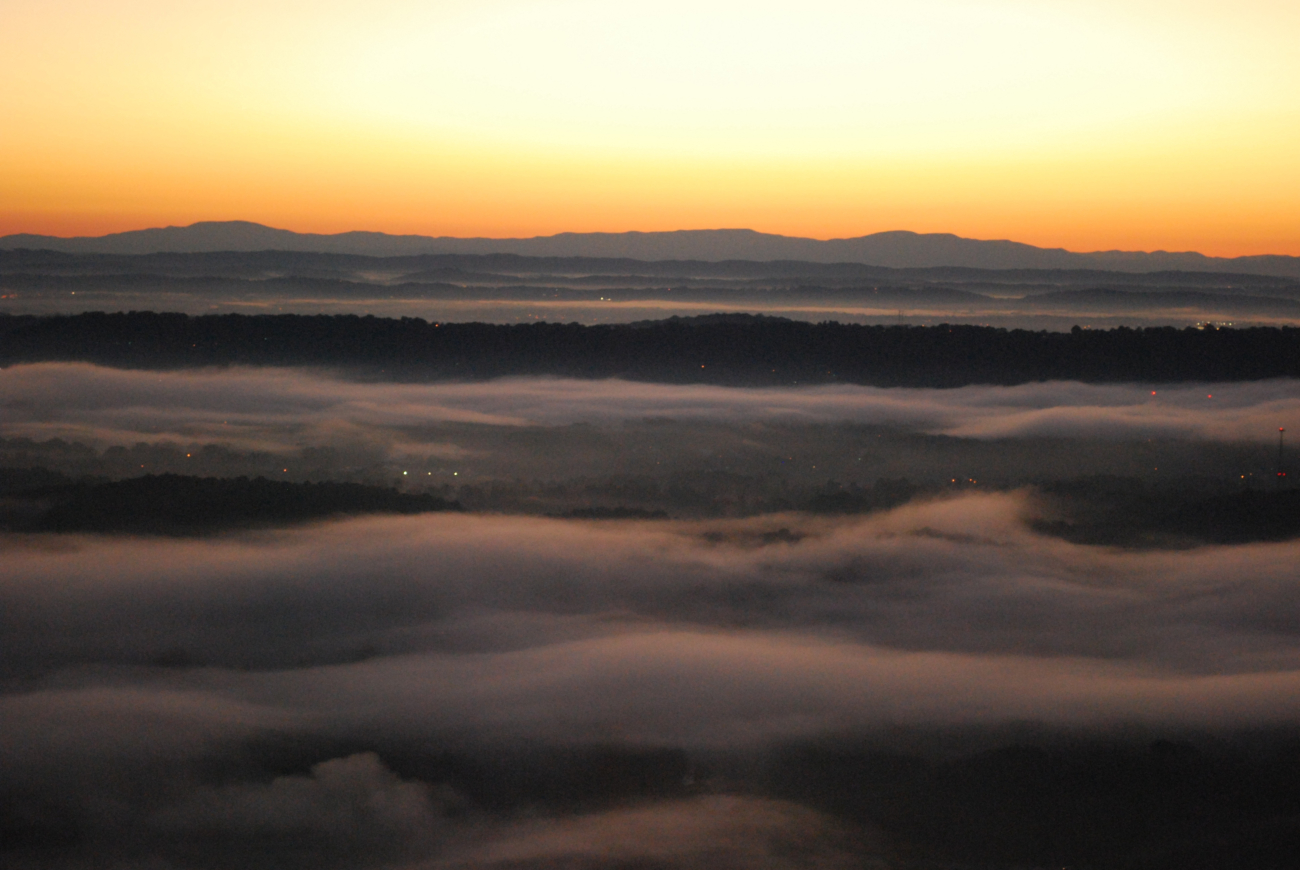 Early morning valley fog fills the river valleys between Missionary Ridge andthe Appalachian Mountains far to the east