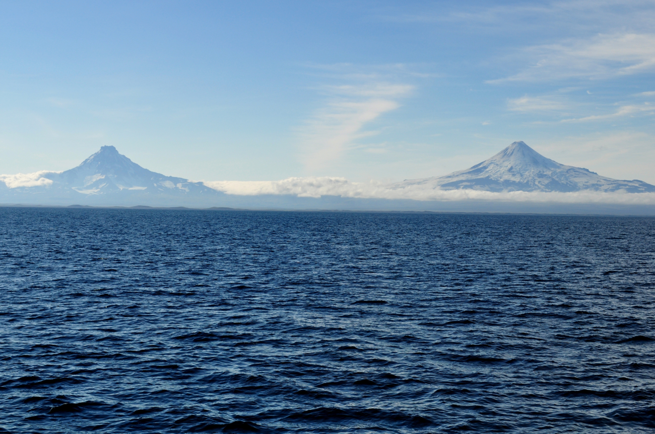 Shishaldin Volcano on the right and Isanotski Volcano, sometimes calledRaggedy Jack, on the left to the east