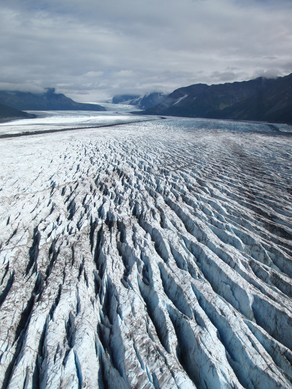 Aerial view of a heavily crevassed glacier