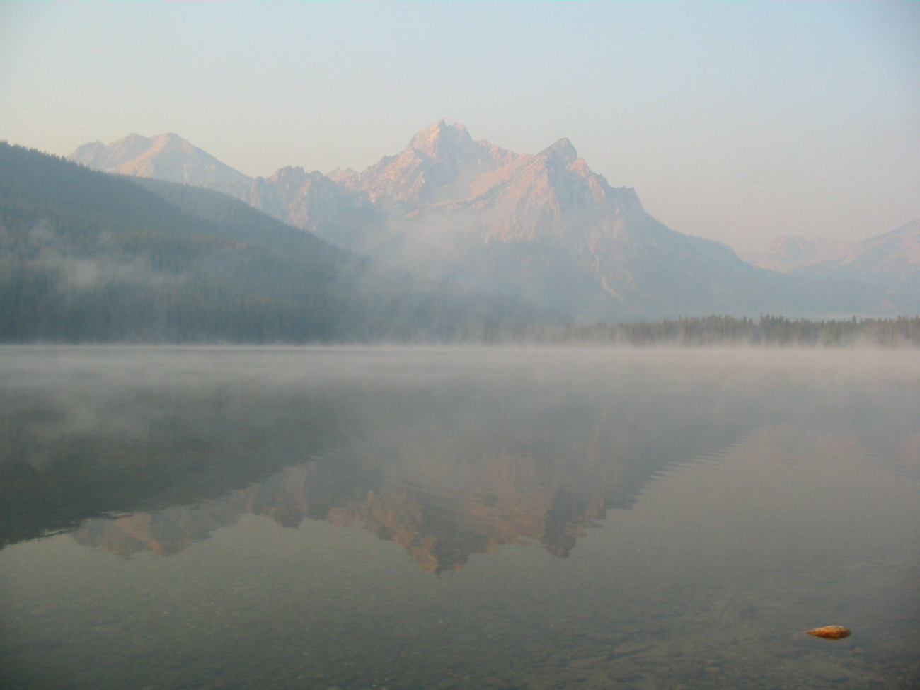 Morning mist and a shimmering reflection on Stanley Lake