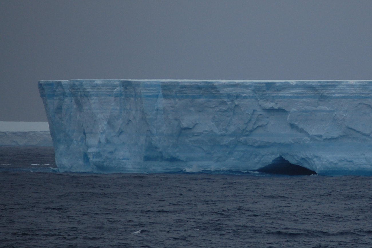 Iceberg with a cave
