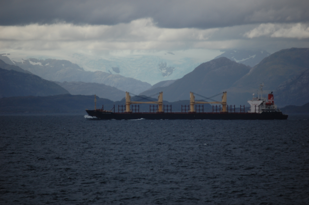A large cargo vessel transiting the Strait of Magellan