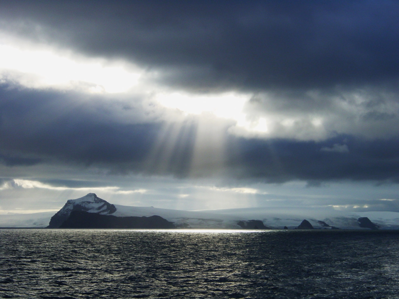 Crepuscular rays illuminating Antarctic Peninsula