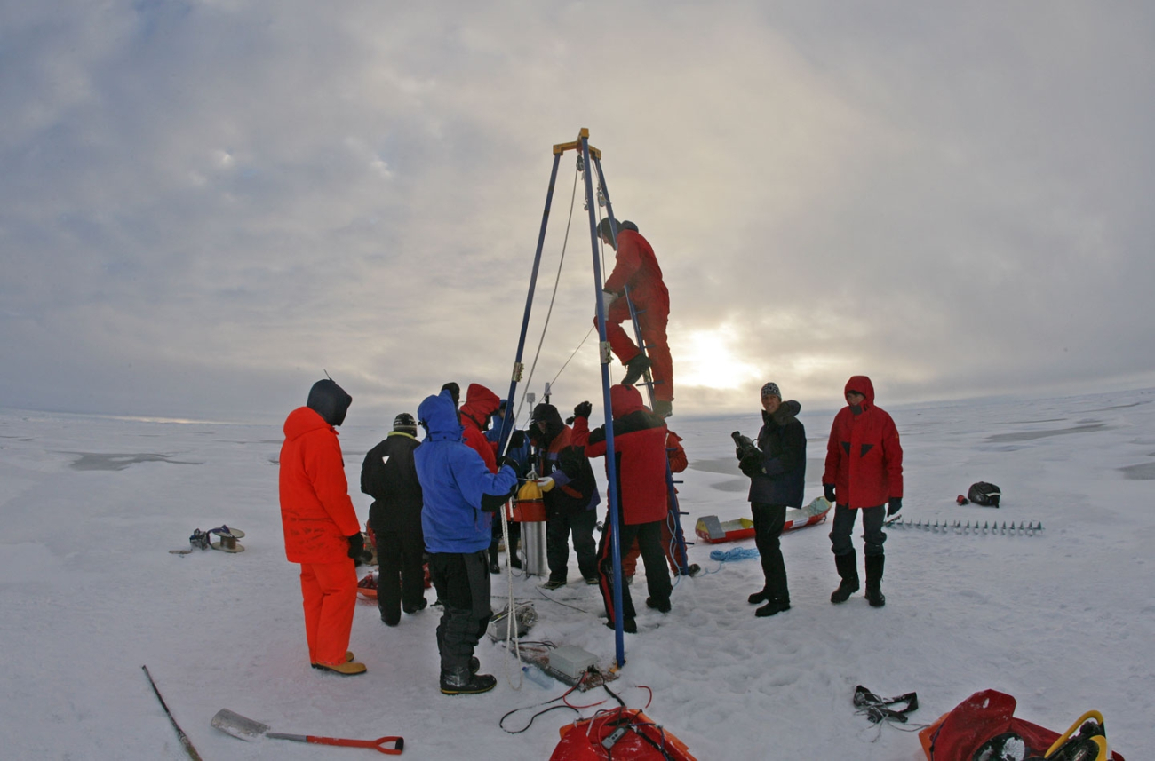 Science team deploying DAMOCLES (Developing Arctic Modeling and Observing Capabilities for Long-term Environmental Studies) system through ice