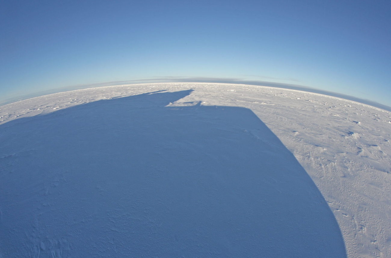 Shadow of the pilot house of the KAPITAN DRANITSYN on the ice
