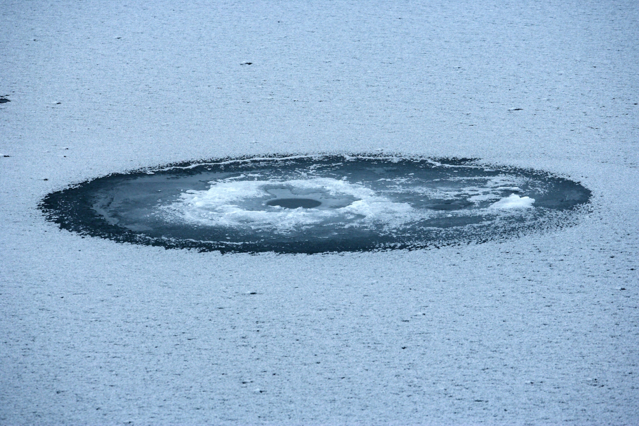A seal breathing hole in the ice