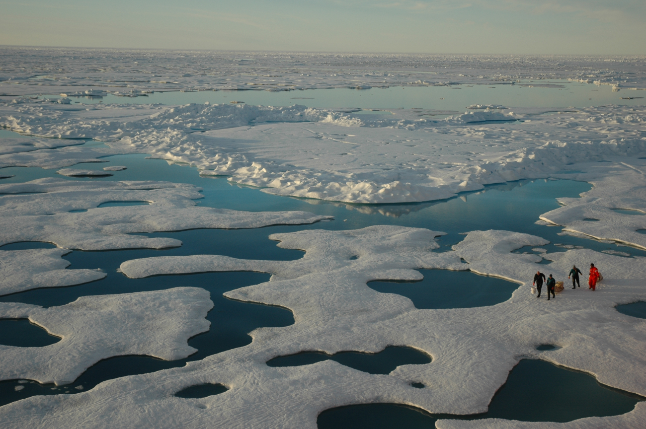 Scientists in an endless vista of ice, sea, and meltwater as seen from theUSCG Icebreaker HEALY