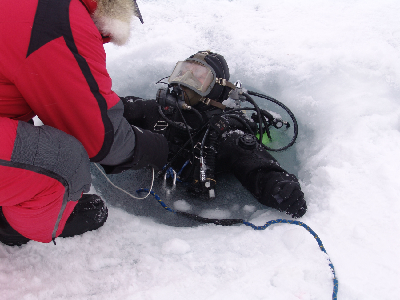 Ice diver at egress hole