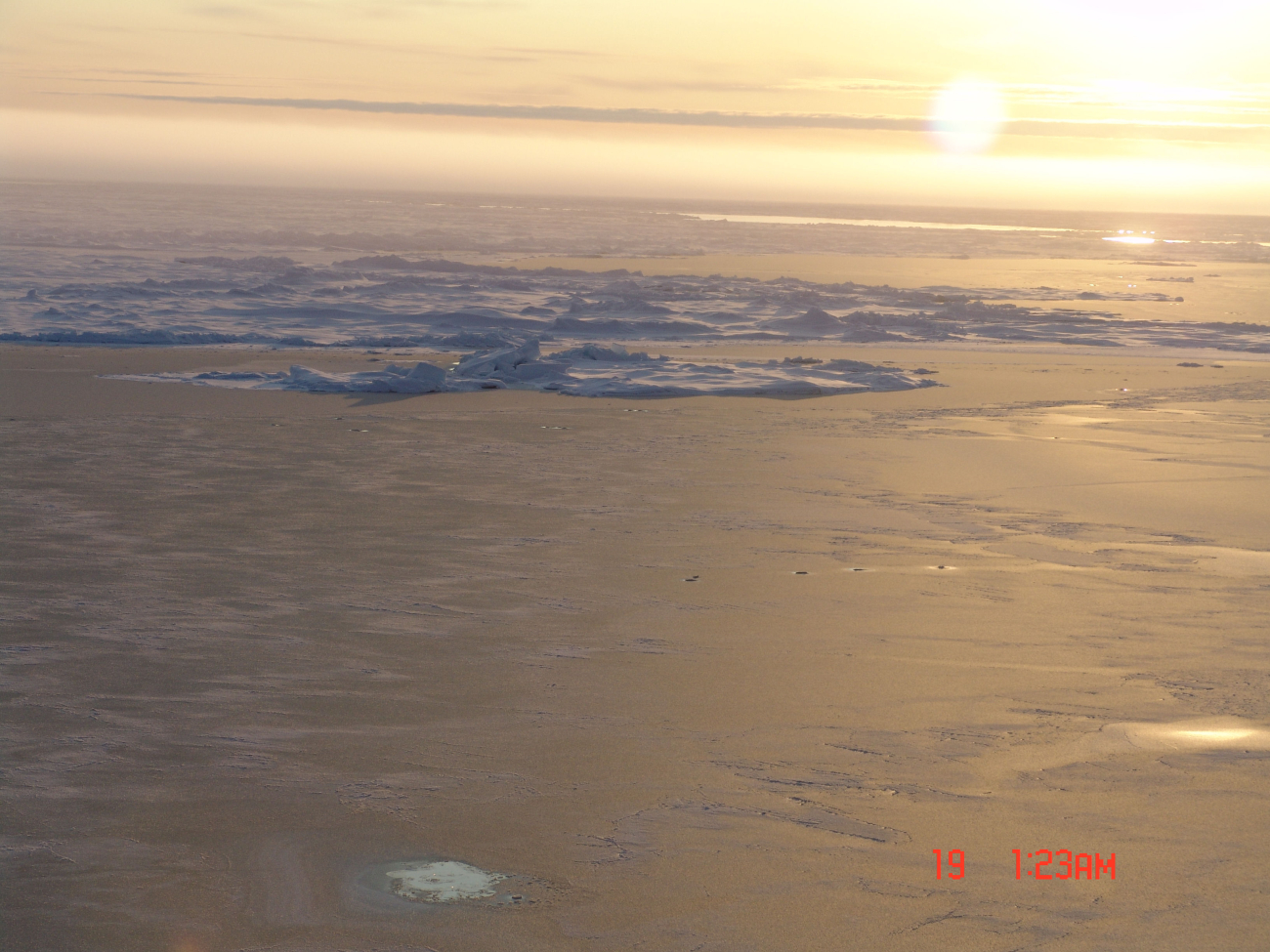 New ice formed over a polynya with ice ridges and mult-year ice in distance