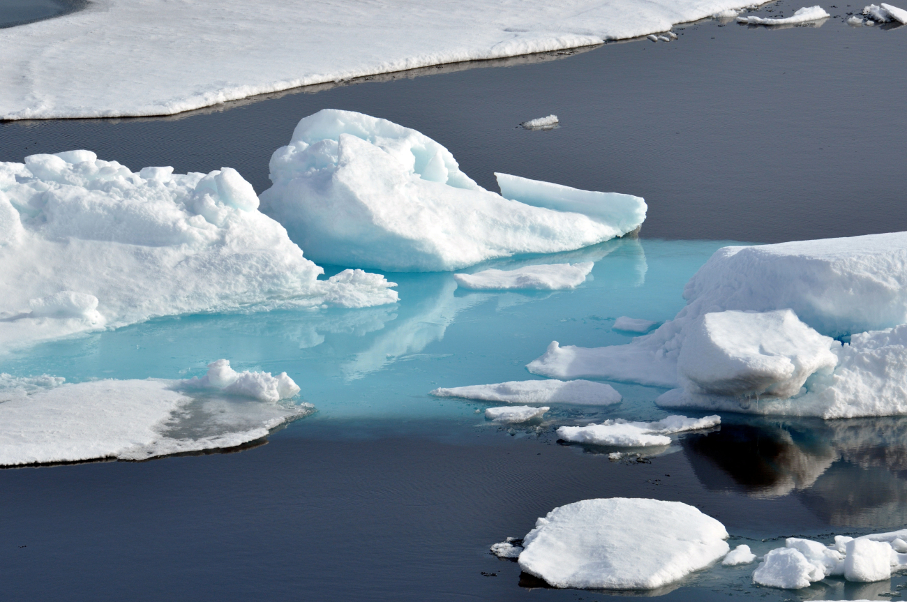 Ice floes, blue-green ice, and open water