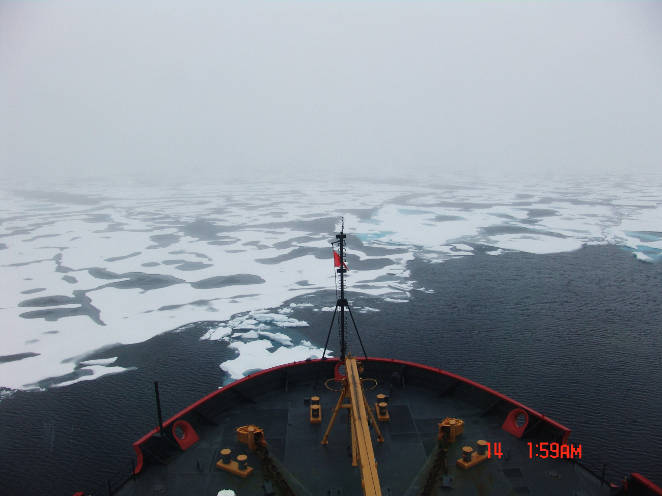 Approaching ice floes and melt pools from the edge of a polynya