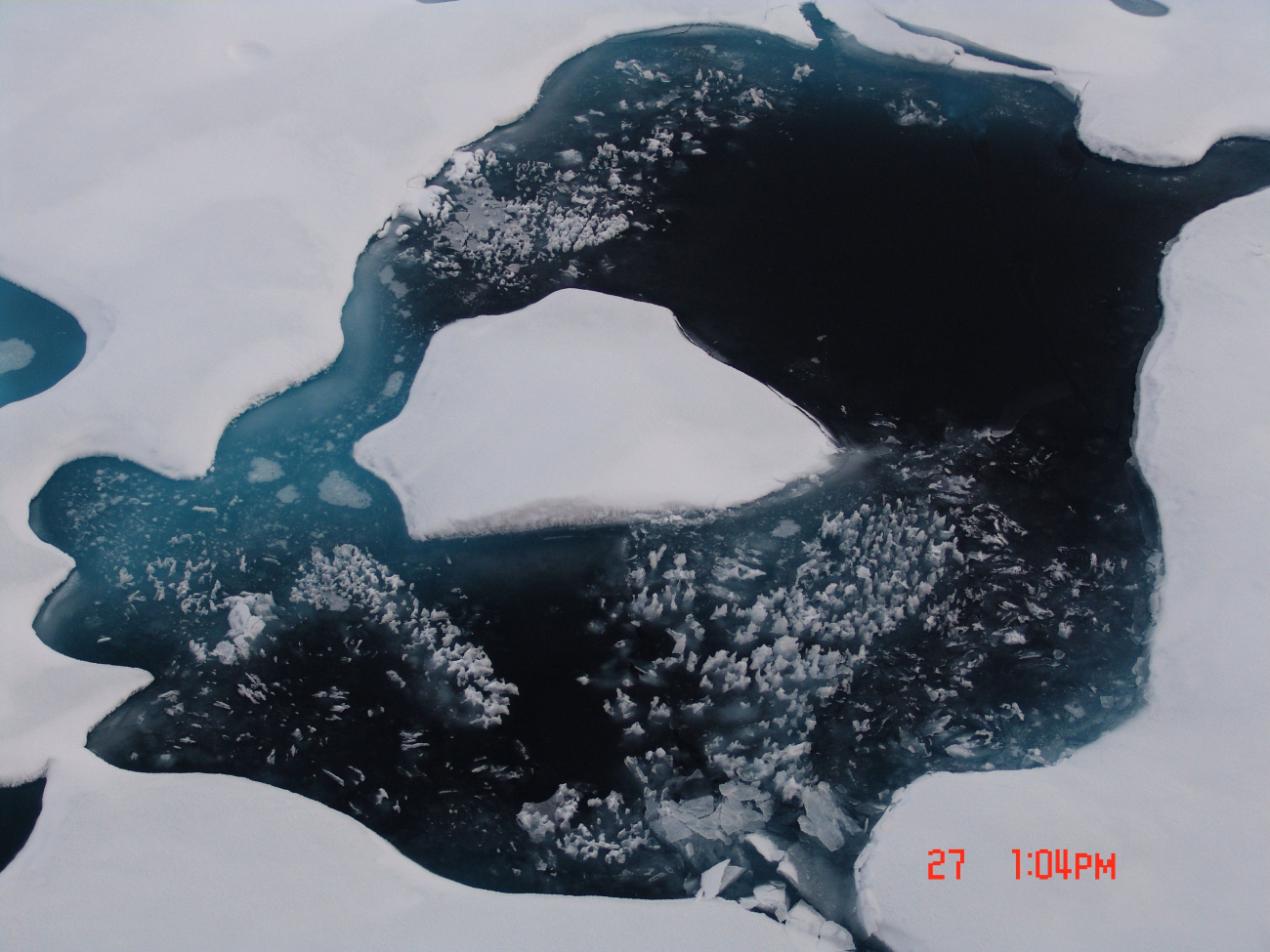 Refreezing melt pond in multi-year ice
