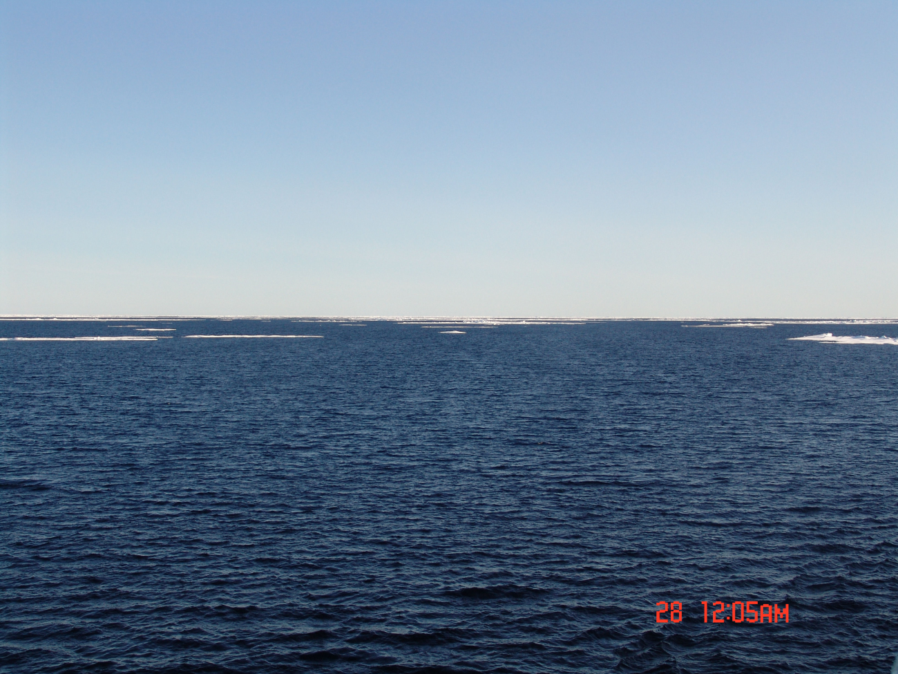 Open water with ice floes in late summer
