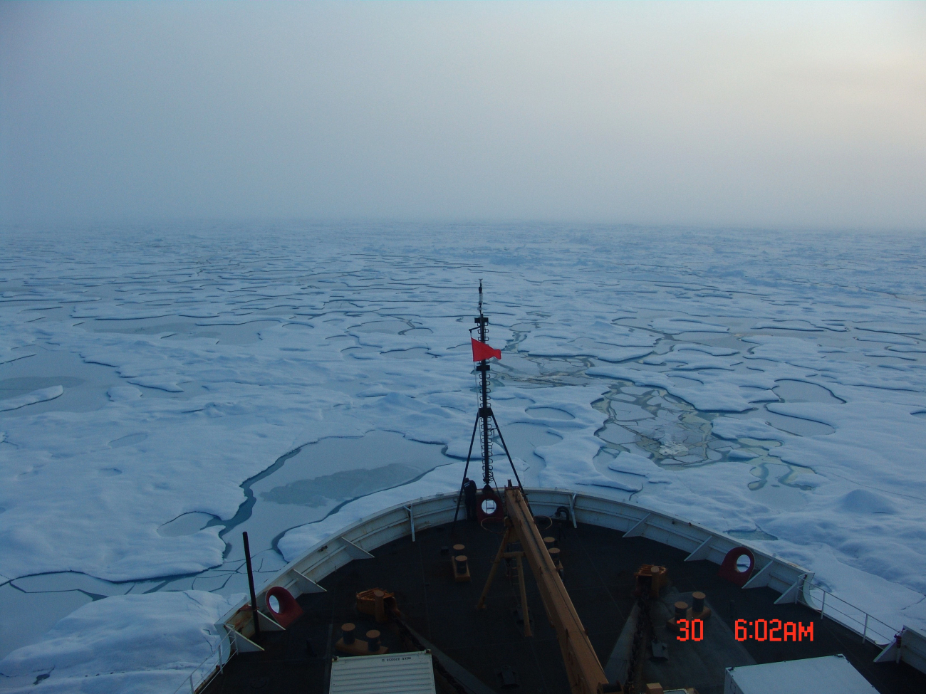 Looking over the bow of the USCGC HEALY towards an extensive area of multi-year ice with refreezing melt ponds