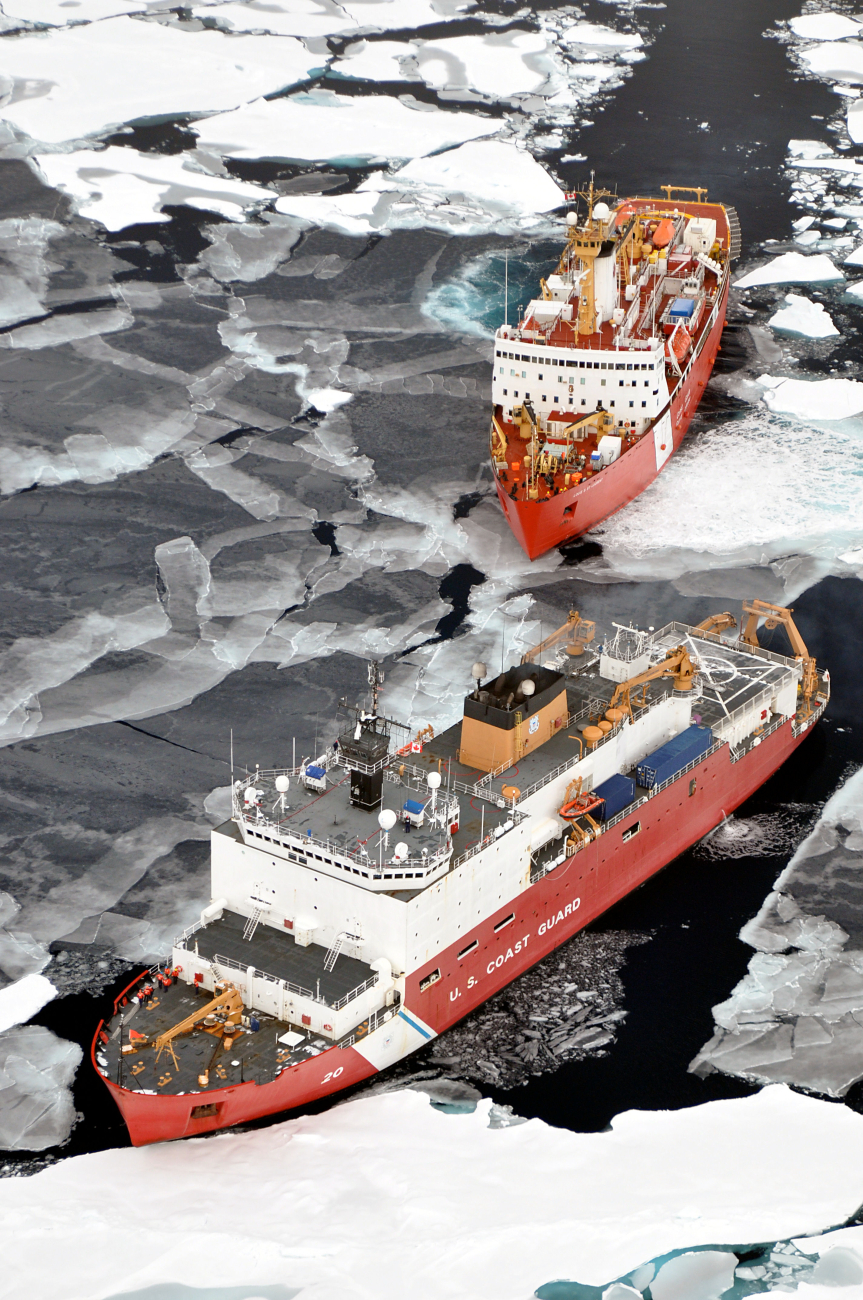USCG icebreaker HEALY in relatively smooth first-year ice floes and nilas icefollowed by the Canadian Coast Guard icebreaker LOUIS S