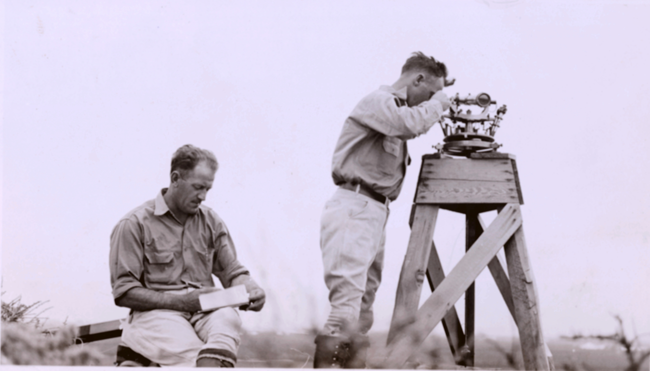 Oscar Risvold recording while Lieutenant William Tucker observses angles